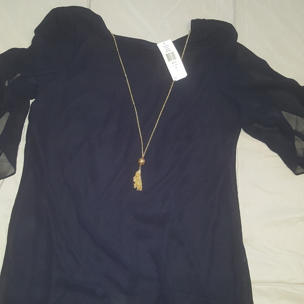 Navy blue dress w/necklace.